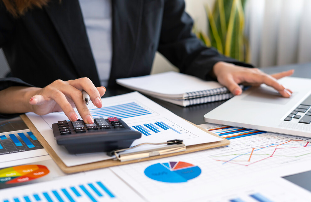 An accountant reviews and analyzes company financial data. .